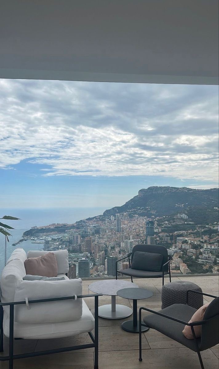 Private Monaco terrace with lounge seating opening onto the principality and the sea below