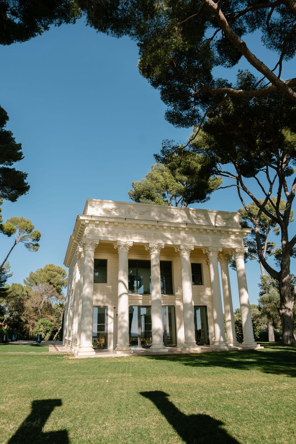Neoclassical Riviera villa with Corinthian columns set in a pine-shaded lawn